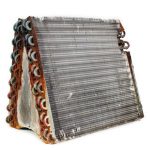 HVAC heat exchanger with metal fins and tubes for A-Plus Air Conditioning services.